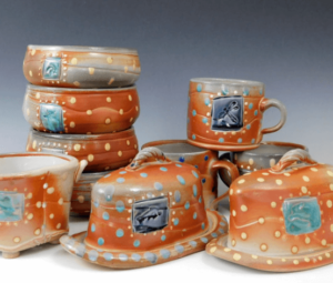 Cups, bowls and covered dishes crafted by Fine Mess Pottery.